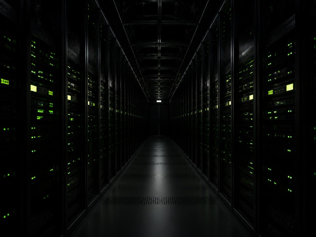 Data centre aisle with illuminated server racks